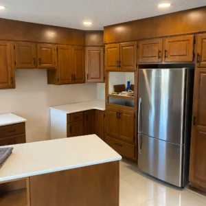 Kitchen renovation with refinished oak cabinets in a medium stain